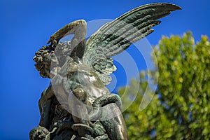 Fountain of the Fallen Angel or Fuente del Angel Caido in the Buen Retiro Park in Madrid, Spain inaugurated in 1885