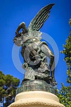 Fountain of the Fallen Angel or Fuente del Angel Caido in the Buen Retiro Park in Madrid, Spain inaugurated in 1885 photo