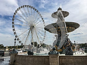 Fountain and ferris wheel in the Place de la Concorde, Paris