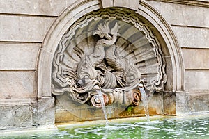 Fountain with fish spouting water