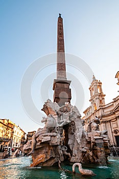 Fountain of the Four Rivers with Egyptian obelisk in Piazza Navona. Classic fountain from the 17th century, in Rome in Lazio, Ital