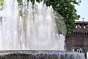 Fountain In front of the entrance to castle known as Castello Sforzesco, Milan, Lombardy, Italy. Closeup