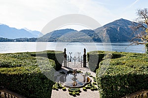 Fountain in front of the gate of Villa Carlotta. Lake Como, Italy