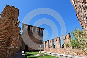 A fountain and garden between fortified walls at Castle Fortress