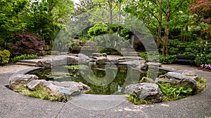 Fountain and garden titled `Genesis Garden` in the Dallas Arboretum and Botanical Garden