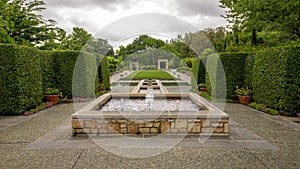 Fountain and garden titled `A Woman`s Garden` in the Dallas Arboretum and Botanical Garden
