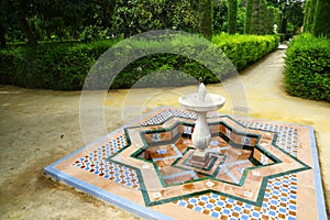 Fountain in gardens of Reales Alcazares, Sevilla photo