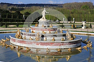 Fountain with gilded ornaments to the Park of Versailles