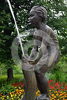 Fountain girl with fish in Zelenogorsk St.- Petersburg.
