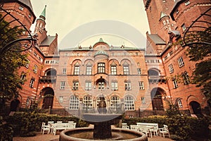 Fountain in green courtyard of Copenhagen City Hall, built in 1905, Denmark. Architecture in the National Romantic style