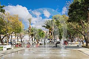 Fountain and horse carriages in town square of Mijas. Malaga pro photo