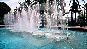 Fountain in Ibiza with the water falling down and the drops bounce, historical monument and travel, shot in slow