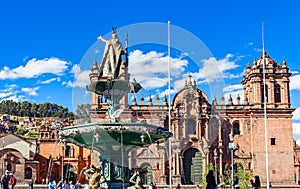 Fountain of Incan emperor Pachacuti and Cuzco cathedral at Plaza De Armas, Cuzco, Peru