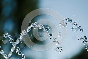 Fountain jet with frozen drops of water