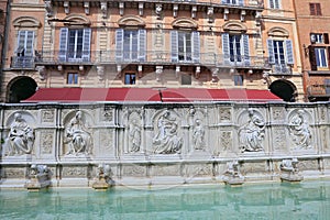 Fountain of joy - a medieval marble fountain in Siena. Panel Fonte Gaia, Piazza del Campo, Siena, Tuscany