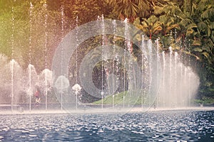 Fountain in KLCC Park in Kuala Lumpur on sunset. Malaysia