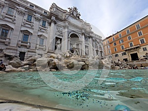 a fountain with many water in it on a sunny day photo