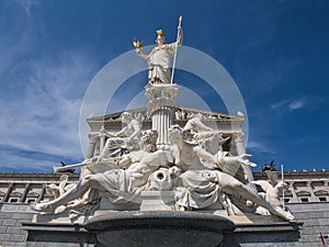 fountain and neoclassical statues of the vienna parliament