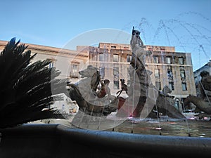 Fountain with palm tree and sculptures in Italy