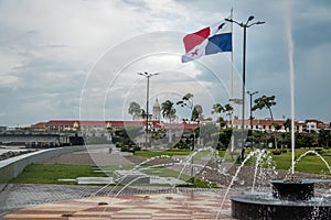 Fountain in Panama City with country flag and Casco Viejo Old City on background - Panama City, Panama