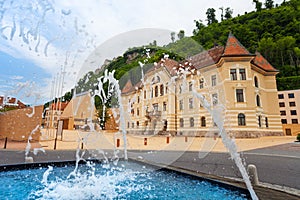 Fountain and pedestrian street in Vaduz , Liechtenstein