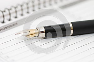 Fountain Pen and blank spiral bound notepad