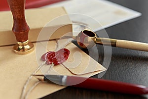 Fountain pen and old notarial wax seal on document, closeup