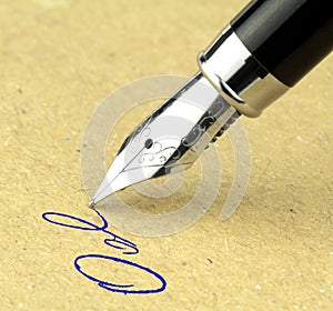 Fountain pen writing on the paper,