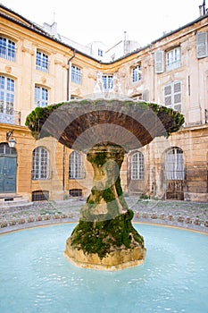 Fountain in Place d`Albertas in Aix-en-Provence, France, in a sunny day