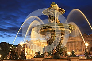 Fountain on Place de la Concorde in Paris at dusk