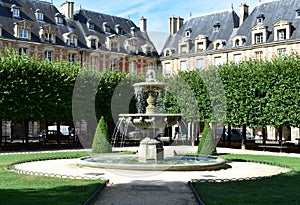Fountain at Place des Vosges. Paris. France.