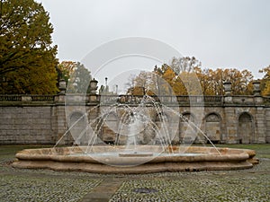 Fountain in the public park, no people, autumn time. Warsaw, Poland.