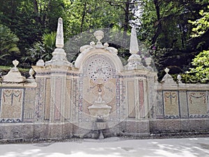 A fountain in the Quinta de la Regaleira Garden. Sintra, Portugal photo