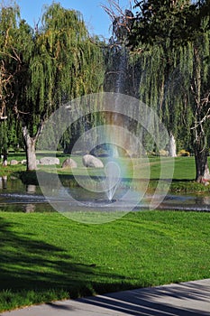 The fountain and  rainbow on the golf course