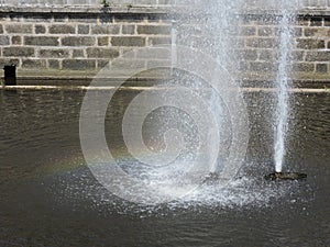 Fountain with rainbow in Karlovy Vary, Czech Republic