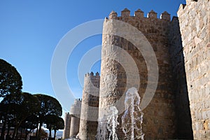 Fountain at San Segundo street, Avila in Spain. The Walls of ÃÂvila in the background photo