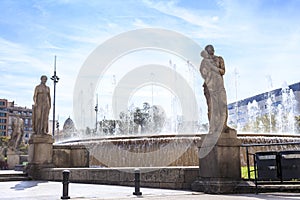 Fountain with sculptures on Placa de Catalunya, Barcelona, Spain photo