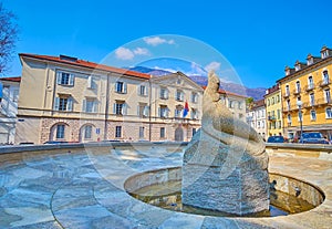 The fountain of the Seal on Piazza Governo at State Chancellery building, Bellinzona, Switzerland photo