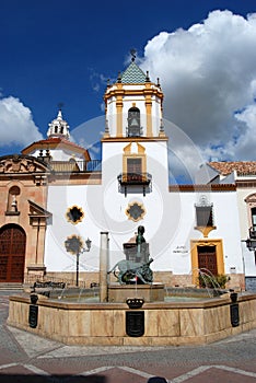 Fountain showing Hercules taming lions with the Socorro Parish church to the rear, Ronda, Spain.