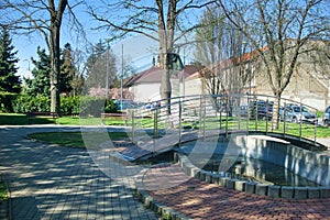 Fountain and small bridge inpark in the city of Ilava