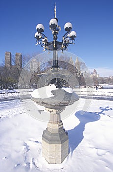 Fountain with snow in Central Park, Manhattan, New York City, NY after winter snowstorm photo