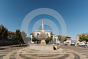 Fountain in a square near the Castle Torre de Moncorvo, Portugal in the summer photo