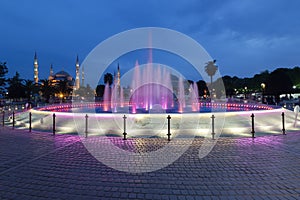 Fountain and the Sultanahmet Blue Mosque at night photo