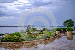 Fountain at sunset with the backdrop of a salt lake and a city in the distance 3