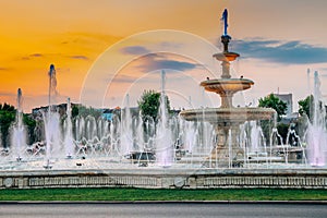 Fountain with sunset at Unirii Square in Bucharest, Romania