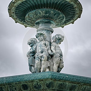 fountain with three babies in Piazza Don Pedro IV, better known as Rossio Square, is one of the central squares of Lisbon