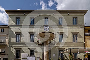 The fountain and the town hall in the Municipio square in Tuoro sul Trasimeno, Perugia, Italy