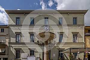 The fountain and the town hall in the Municipio square in Tuoro sul Trasimeno, Perugia, Italy photo