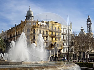 Fountain in the town hall square in the background, Noguera House (1909). Valencia, Spain.