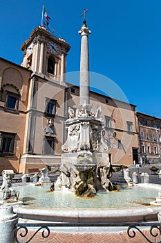 Fountain and town hall in the square of Tarquinia